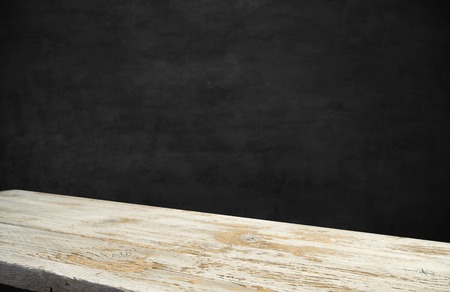 Empty wooden table in front of abstract blurred background of coffee shop . can be used for display...