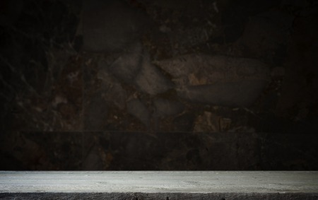 Old wooden table with brick backgroundの写真素材