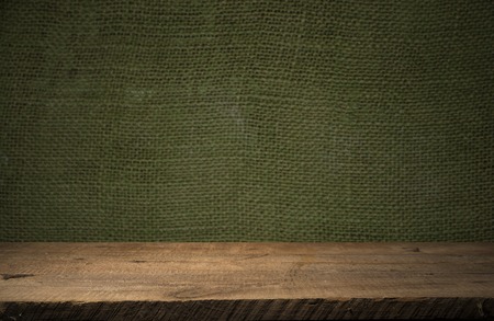 background of barrel and worn old table of woodの写真素材