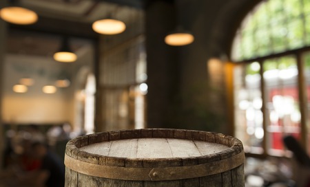 blurred background of bar and dark brown desk space of retro woodの写真素材