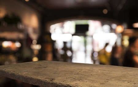Wood table top with reflect on blur of lighting in night cafe,の写真素材