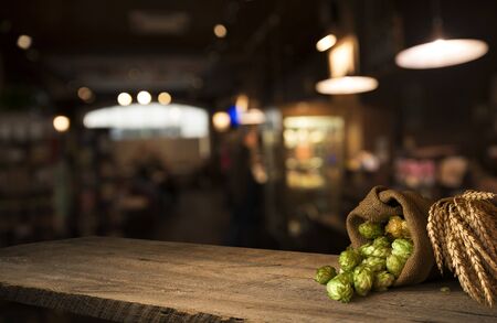 Still life with a keg of beer and hops.