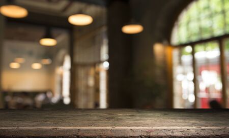 blurred background of bar and dark brown desk space of retro woodの写真素材