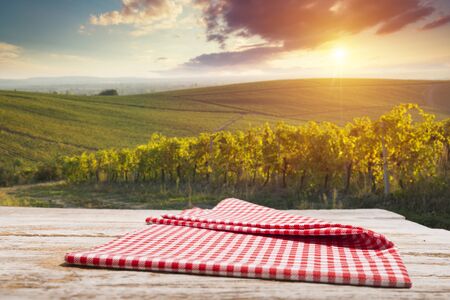 Vineyard tabletop design. Wine background. Autumn design with vineyard and empty display. Autumn grapes harvestの写真素材