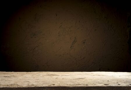 Empty wood table top on blur light gold bokeh of cafe restaurant in dark background.