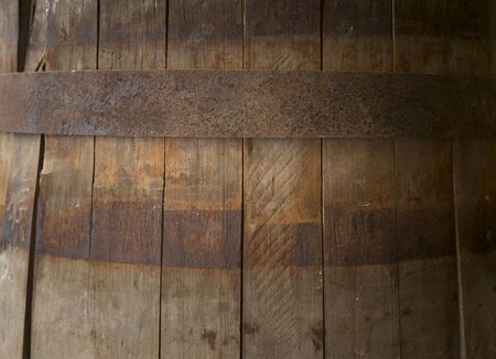 background of barrel and worn old table of wood.