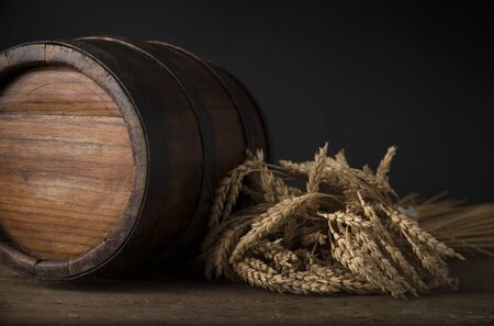 Old wooden barrel on a brown background