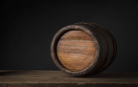 Old wooden barrel on a brown backgroundの写真素材