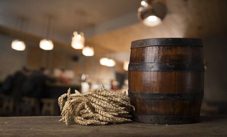 Old wooden barrel on a brown backgroundの写真素材