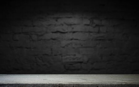 Wood table in front of rustic brick wall blur background with empty copy space on the table for...
