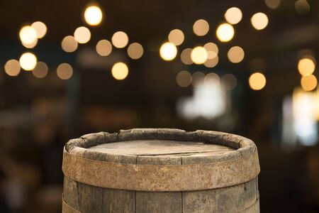 Beer barrel with beer glasses on table on wooden backgroundの写真素材