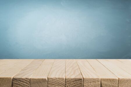 Heavenly blue wall and empty turquoise table.の写真素材