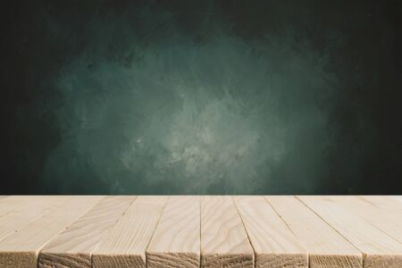 Heavenly blue wall and empty turquoise table.