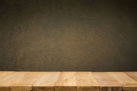 Empty brown wooden table and blur background of abstract of resturant lights people enjoy eating ,can be used for montage or display your productsの写真素材