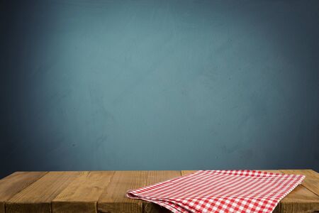 Empty wooden deck table over mint wallpaper background