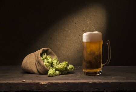Beer barrel with beer glasses on wooden backgroundの写真素材