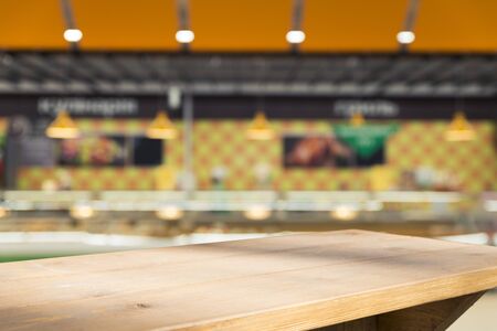 Supermarket background, Counter over blur grocery background, Wooden desk, table, shelf and blur...