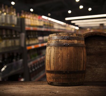 Wine bottles on wooden shelf in wine store