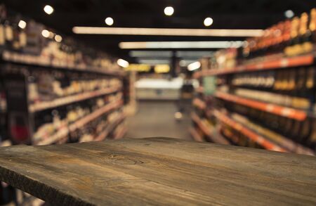 Empty wood table top on blurred market fruit. can montage or display your products