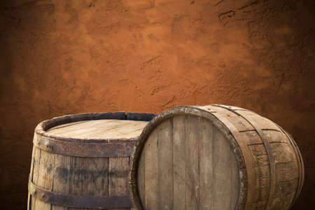 Wooden barrel on a table and textured background