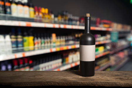 the still life with red wine, bottle, glass and old barrelの写真素材