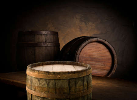 Beer style- bottle, beer in the glass and covers on wooden table. Free space for text. Top view