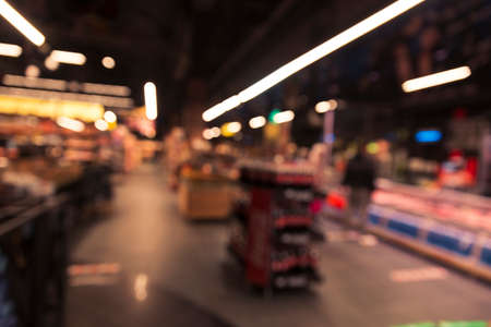 Empty wood table top on blurred market fruit. can montage or display your productsの写真素材