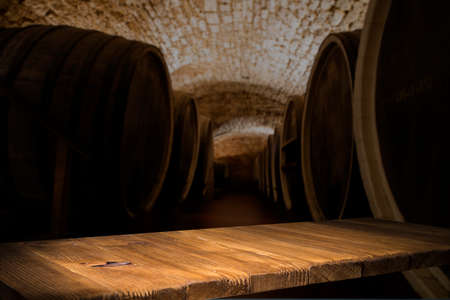 Old wooden barrel on a brown backgroundの写真素材