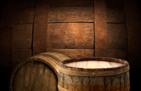 Wooden barrel on a table and textured backgroundの写真素材