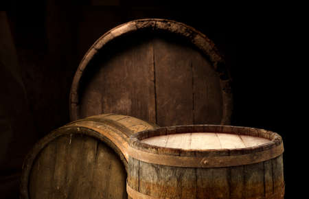 Wooden barrel on a table and textured backgroundの写真素材