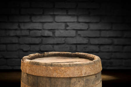 Wooden barrel on a table and textured backgroundの写真素材