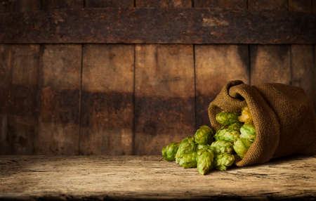Wooden barrel on a table and textured backgroundの写真素材