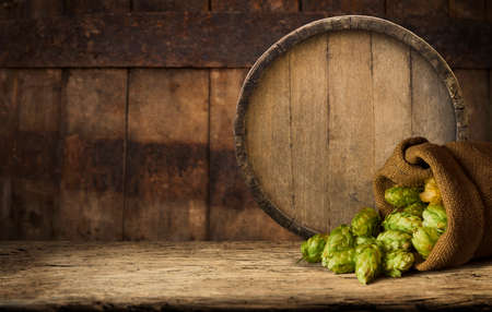 Wooden barrel on a table and textured backgroundの写真素材