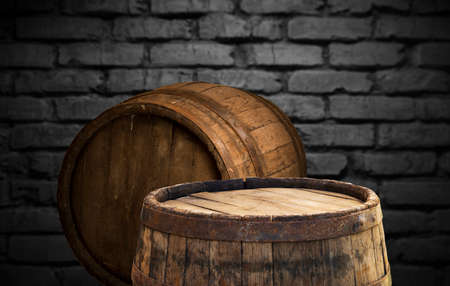 Wooden barrel on a table and textured backgroundの写真素材