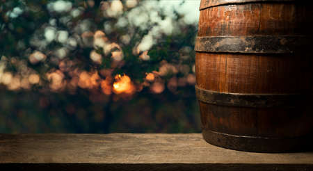 Old wooden barrel on a brown backgroundの写真素材