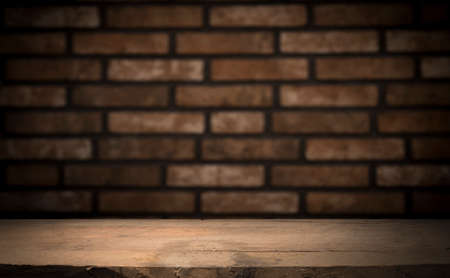 Empty wooden table top with lights bokeh on blur restaurant background.の写真素材
