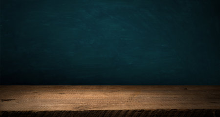 Wooden table with dark blurred background. Highの写真素材