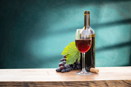 red wine bottle and wine glass onの写真素材
