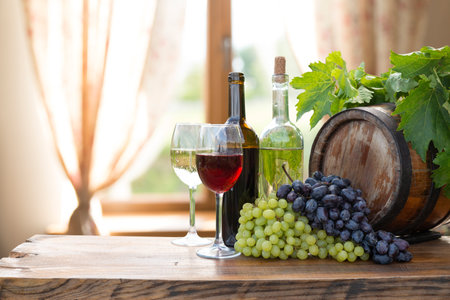 red wine bottle and wine glass onの写真素材