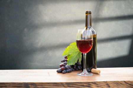 red wine bottle and wine glass onの写真素材