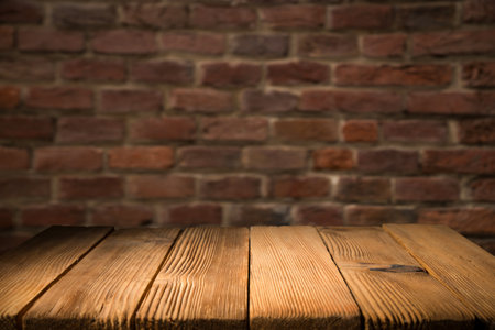 wood table green wall background with sunlightの写真素材