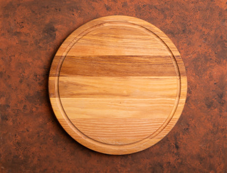 Wooden board stand on tablecloth over grungeの写真素材