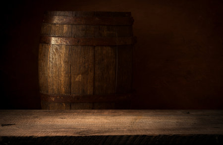 Old wooden barrel on a brown backgroundの写真素材