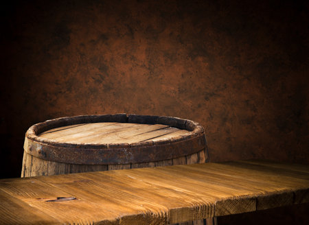 background of barrel and worn old tableの写真素材