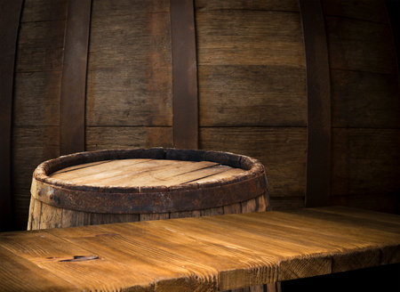 background of barrel and worn old tableの写真素材