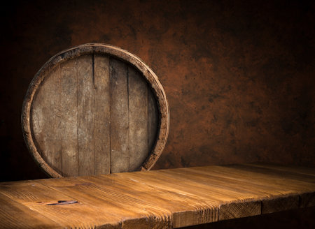 background of barrel and worn old tableの写真素材