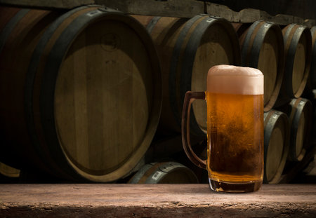 Beer barrel with beer glasses on tableの写真素材