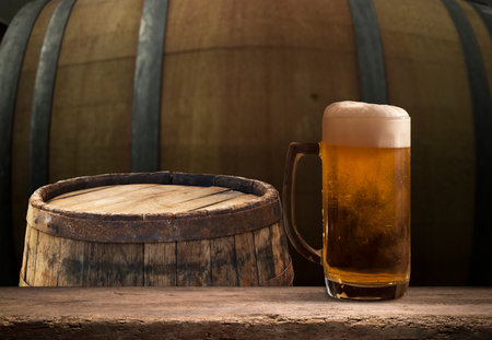 Beer barrel with beer glasses on tableの写真素材