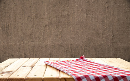 Retro background with wooden table and tableclothの写真素材
