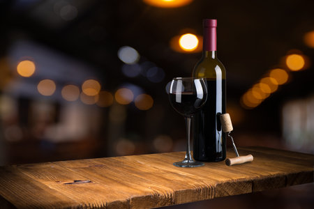 Bottle and glass of red wine onの写真素材